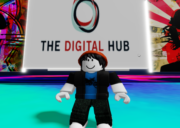 An image of Roblox game featuring a character in the game and 'The Digital Hub' logo in the background.